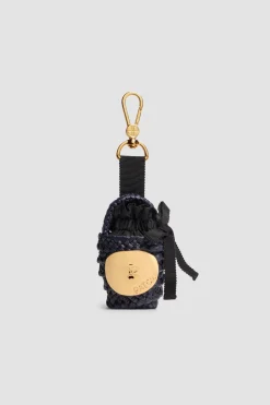 Iconic bucket charm in raffia