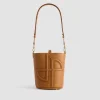 Small JP bucket bag in leather and canvas